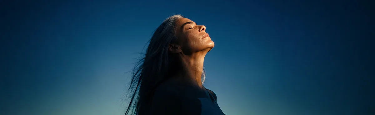 A woman enjoying a quiet moment outdoors